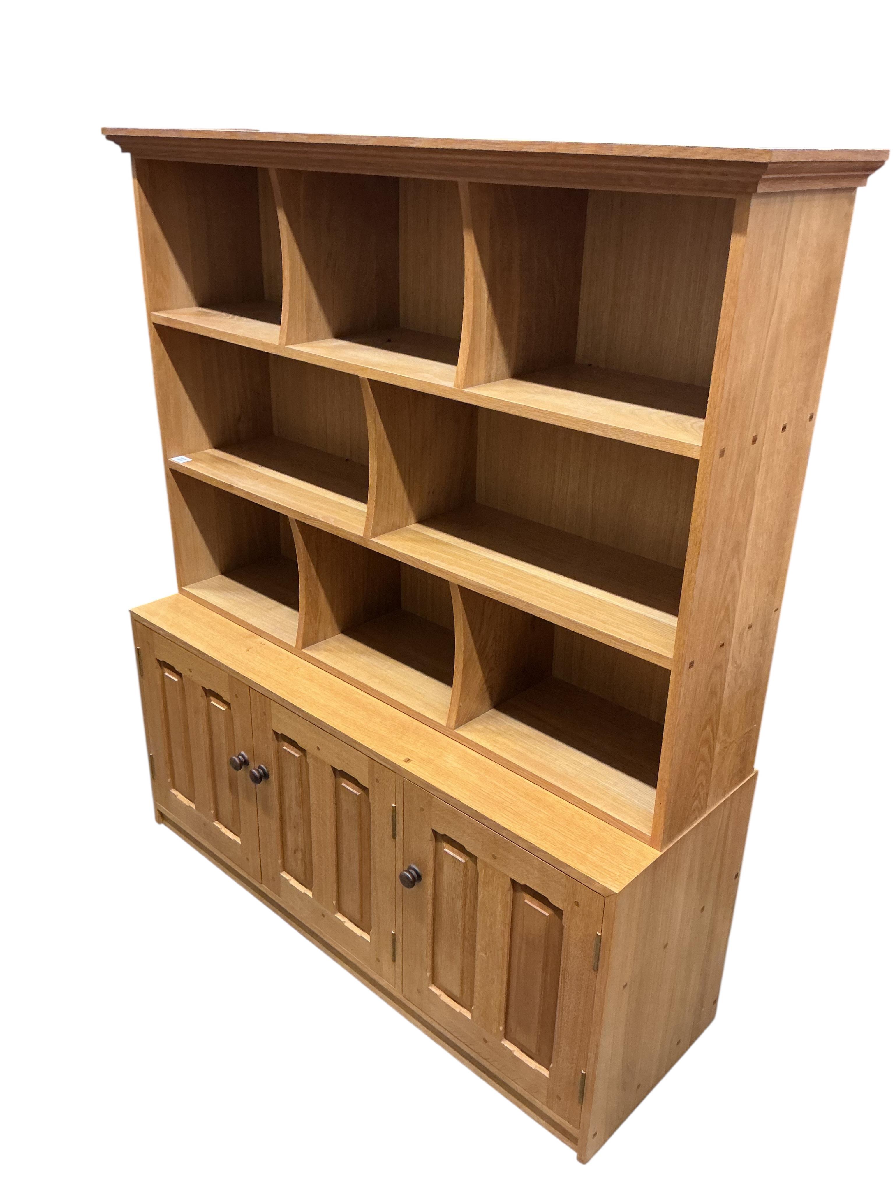 A Contemporary bespoke oak open bookcase, cupboards below, width 141cm, depth 46cm, height 169cm
